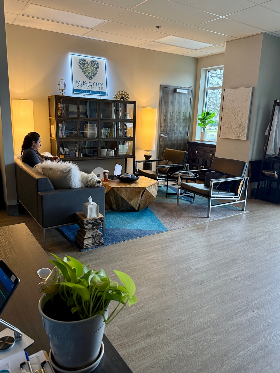 Music City Ketamine lobby with therapy dog and staff member in Franklin Tennessee